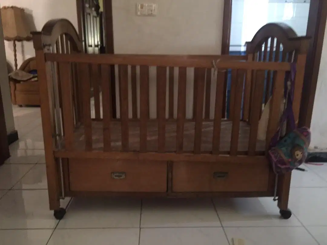 Pure wooden cot in brown color