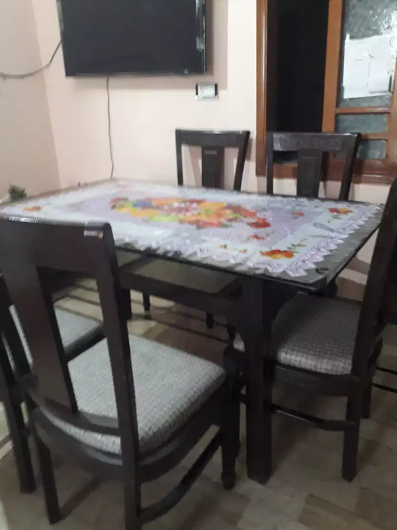 Dinning table with chiars .