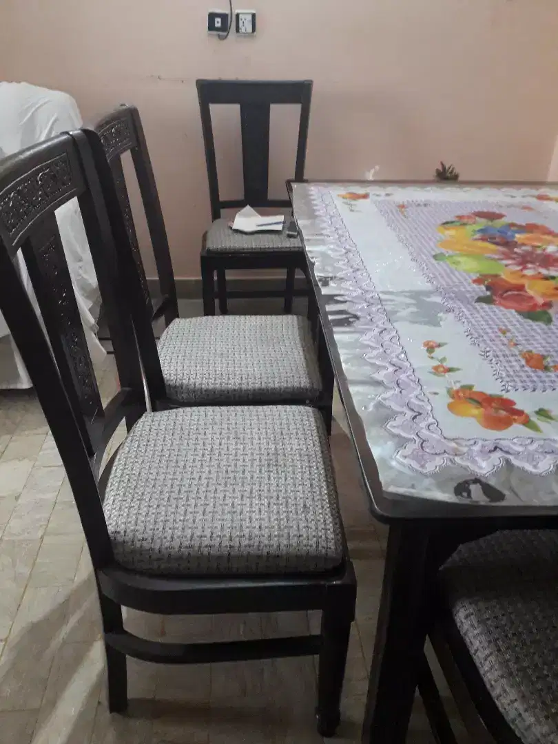 Dinning table with chiars .