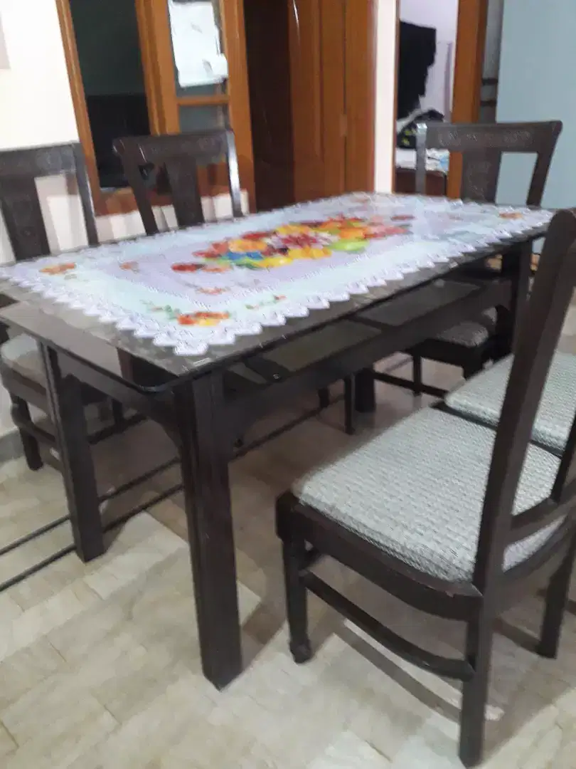 Dinning table with chiars .