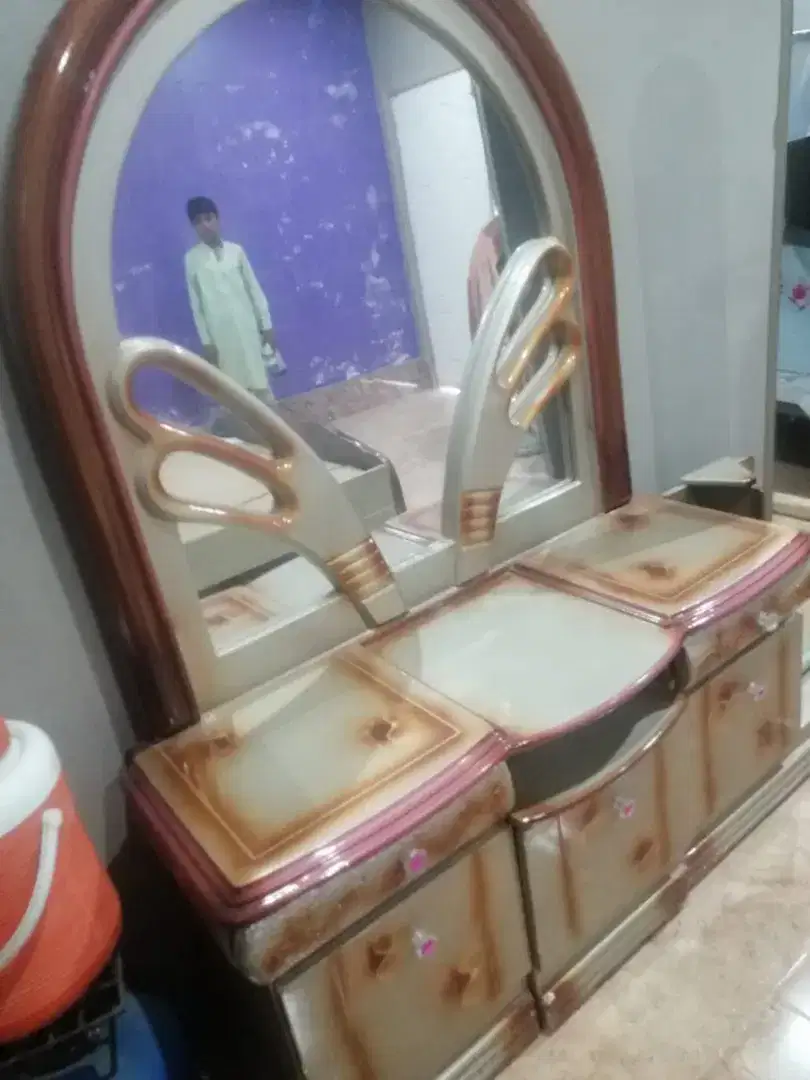 Almost new bed and dressing table and 2 side tables. Slightly used.