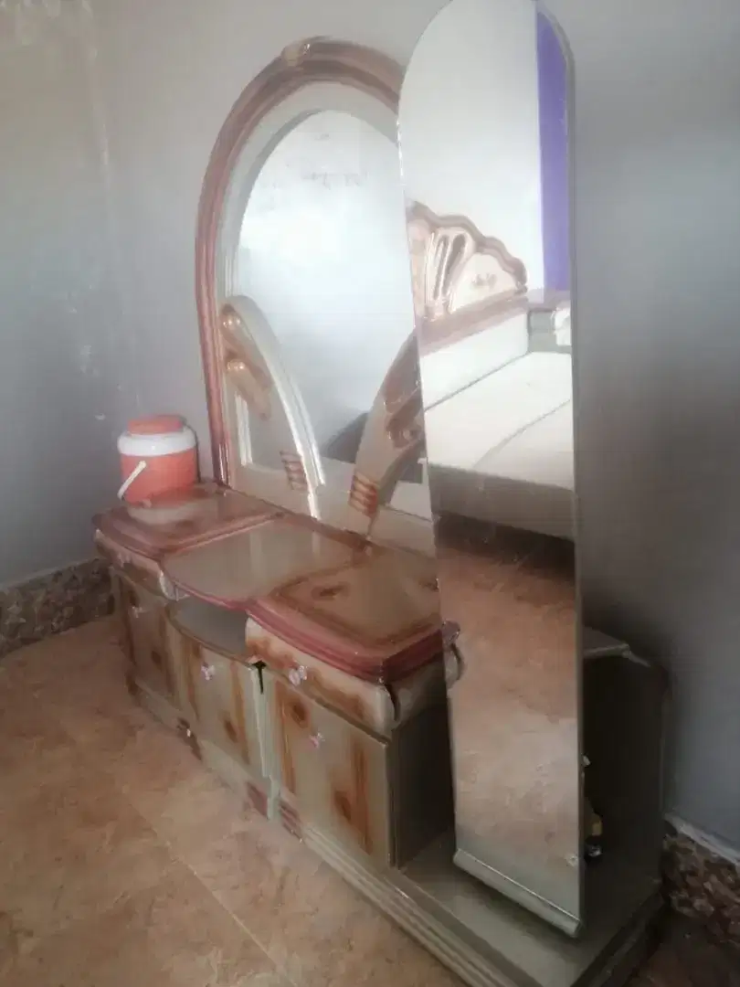 Almost new bed and dressing table and 2 side tables. Slightly used.