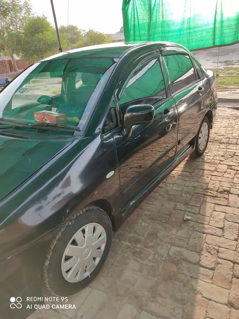 Black Suzuki Liana family used Car Available for Sale in Khanewal