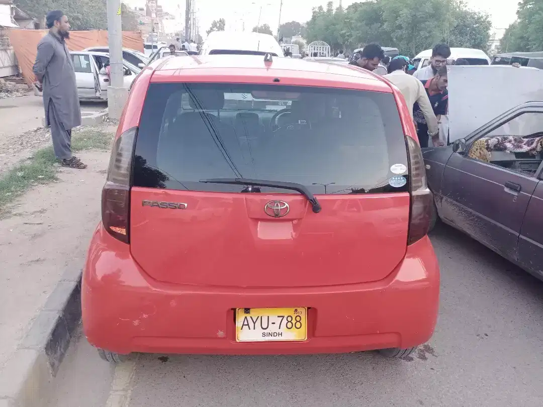 Car Toyota Passo 2007 Model in Red Color Available for Sale in Karchi