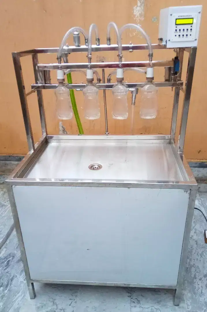 Auto filling water milk juice hand sanitizer dishwash oil machine Available