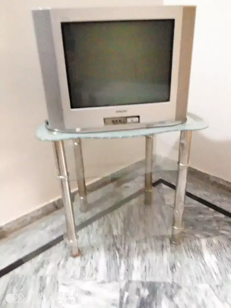 TV with tv trolley available for sale