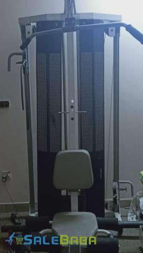 A complete gym equipment with back exercises, legs , arm chains